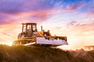 Bulldozer bucket being used in construction