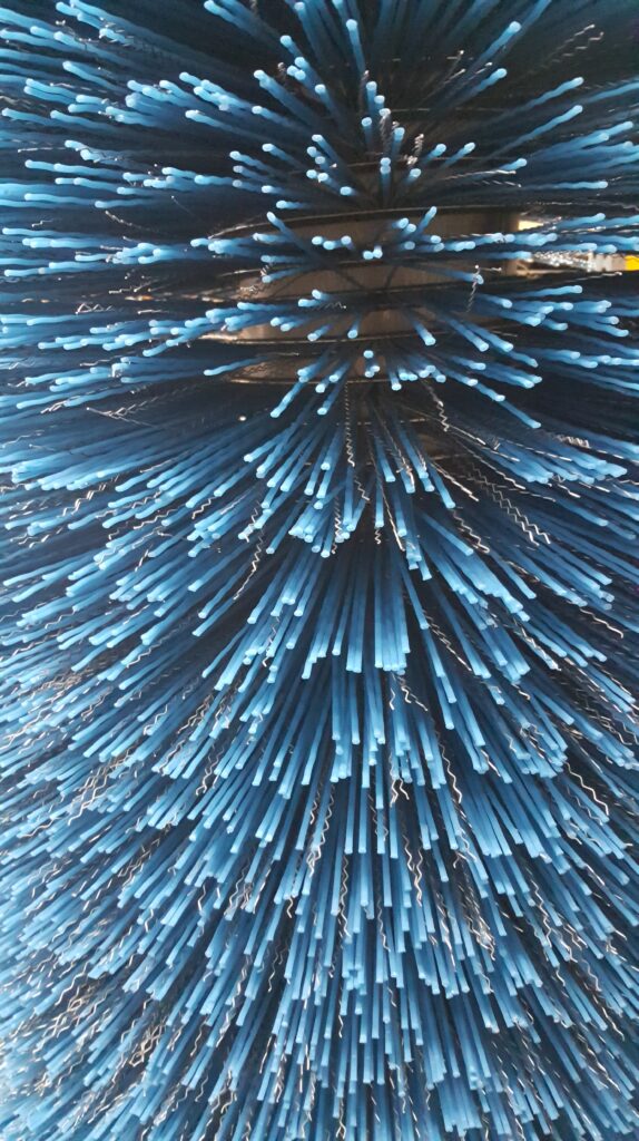 Closeup of blue tube broom
